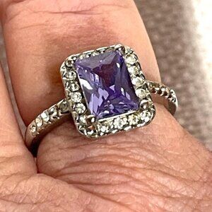 Silver and amethyst-like stone fashion ring.